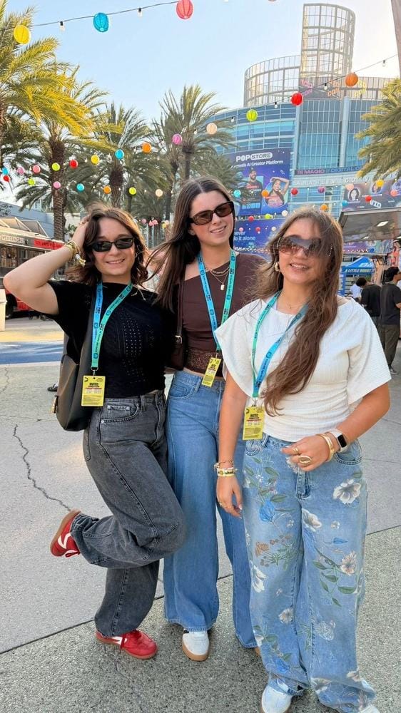 Angelina, Scarlett, and Annabella outside the Anaheim Convention Center at VidCon wearing their Invited Creator badges